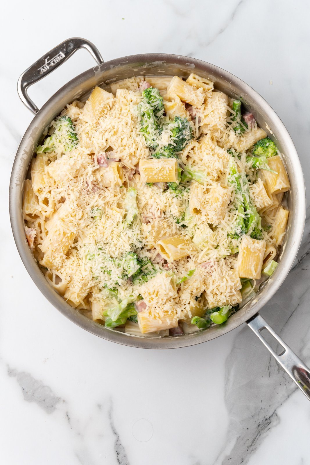 the finished ham aflredo dish with a sprinkle of parmesan cheese