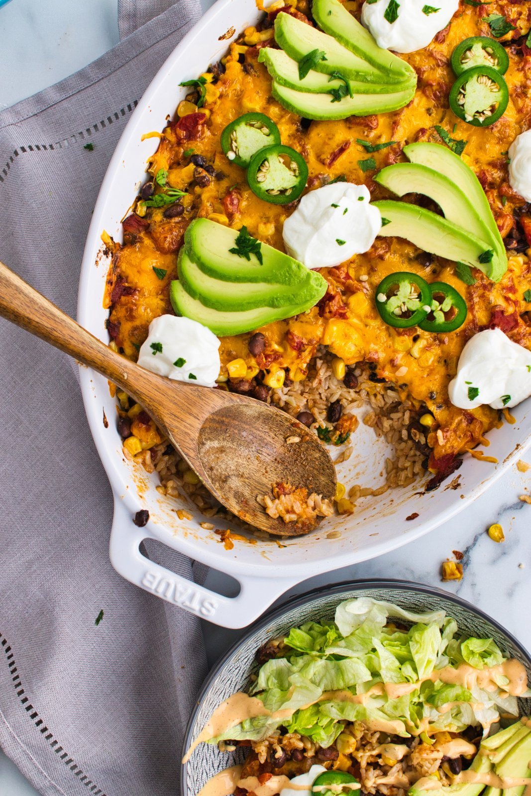 a top down image of the casserole with a scoop missing