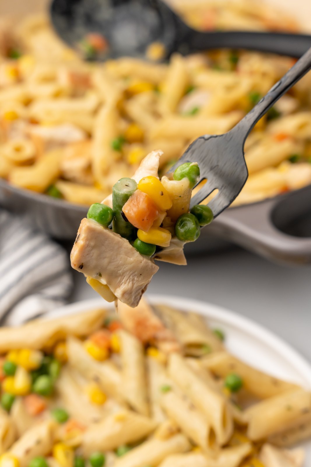 a fork full of chicken pot penne