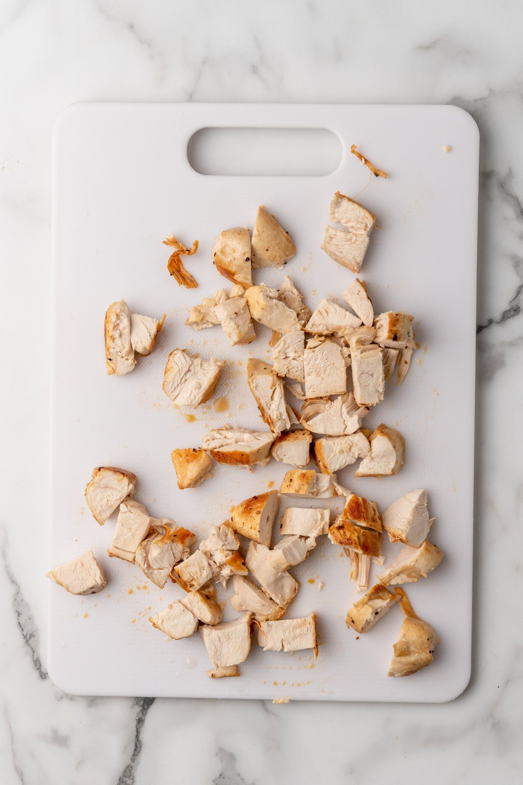 chopped chicken breast on a cutting board