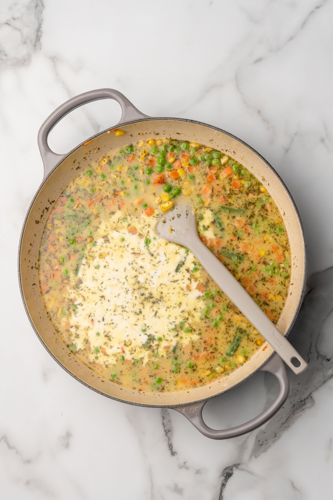 heavy cream added to the pot with veggies and sauce