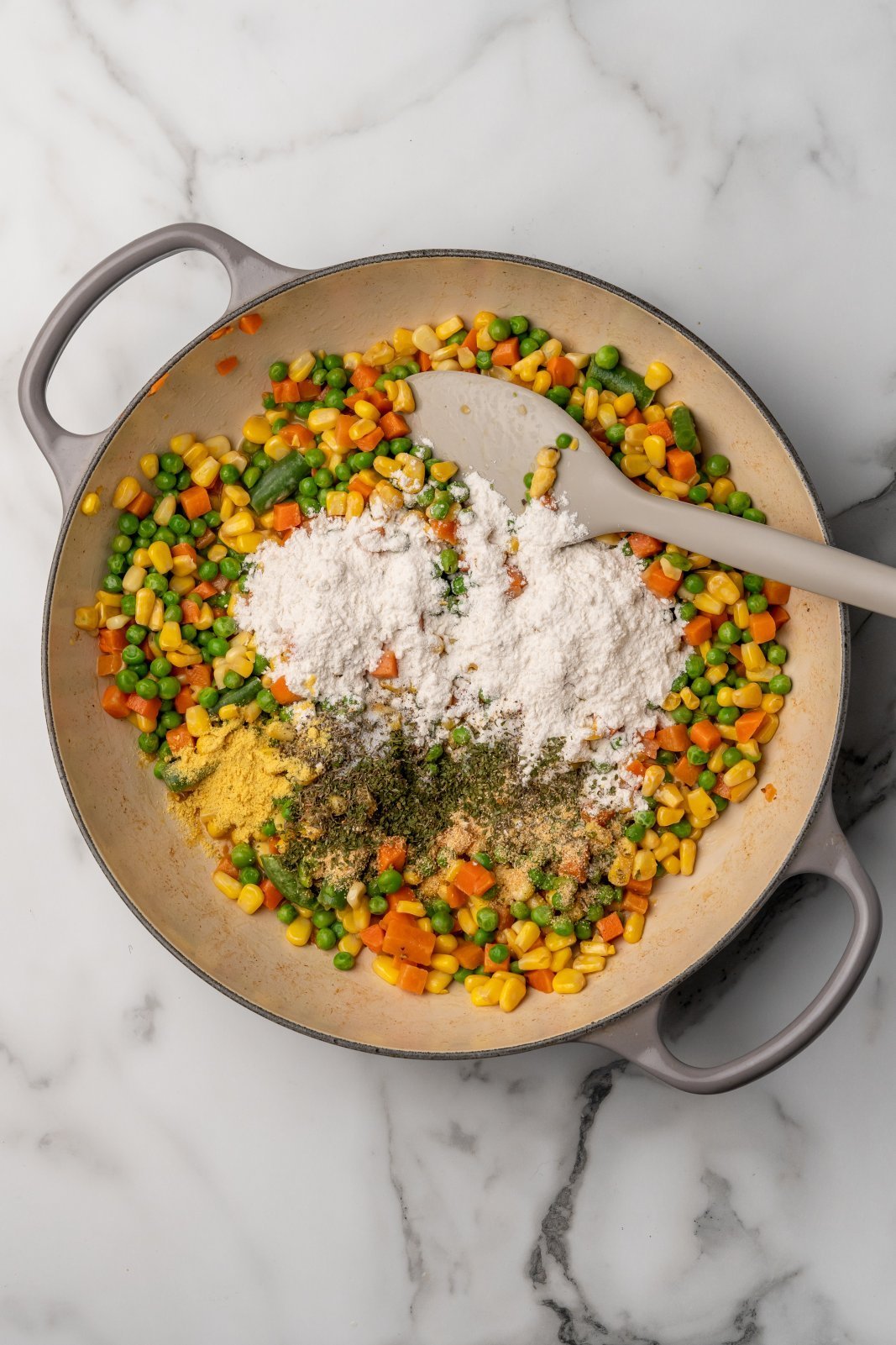flour and seasonings added to the veggies