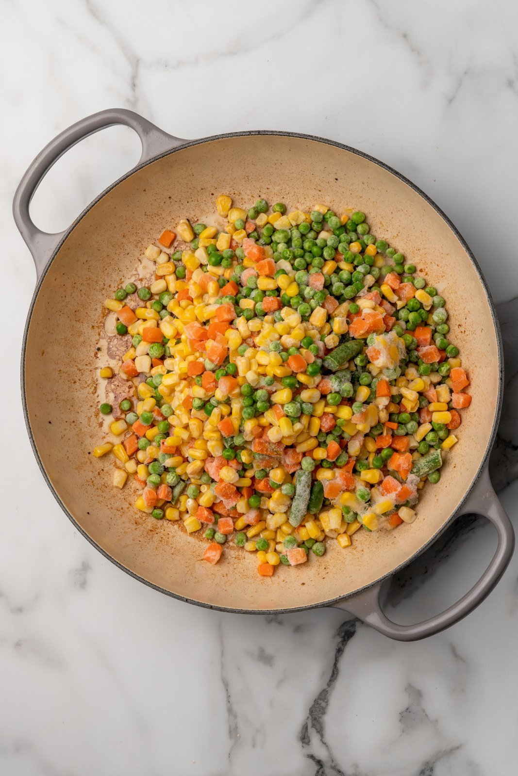 frozen veggies added to large pan