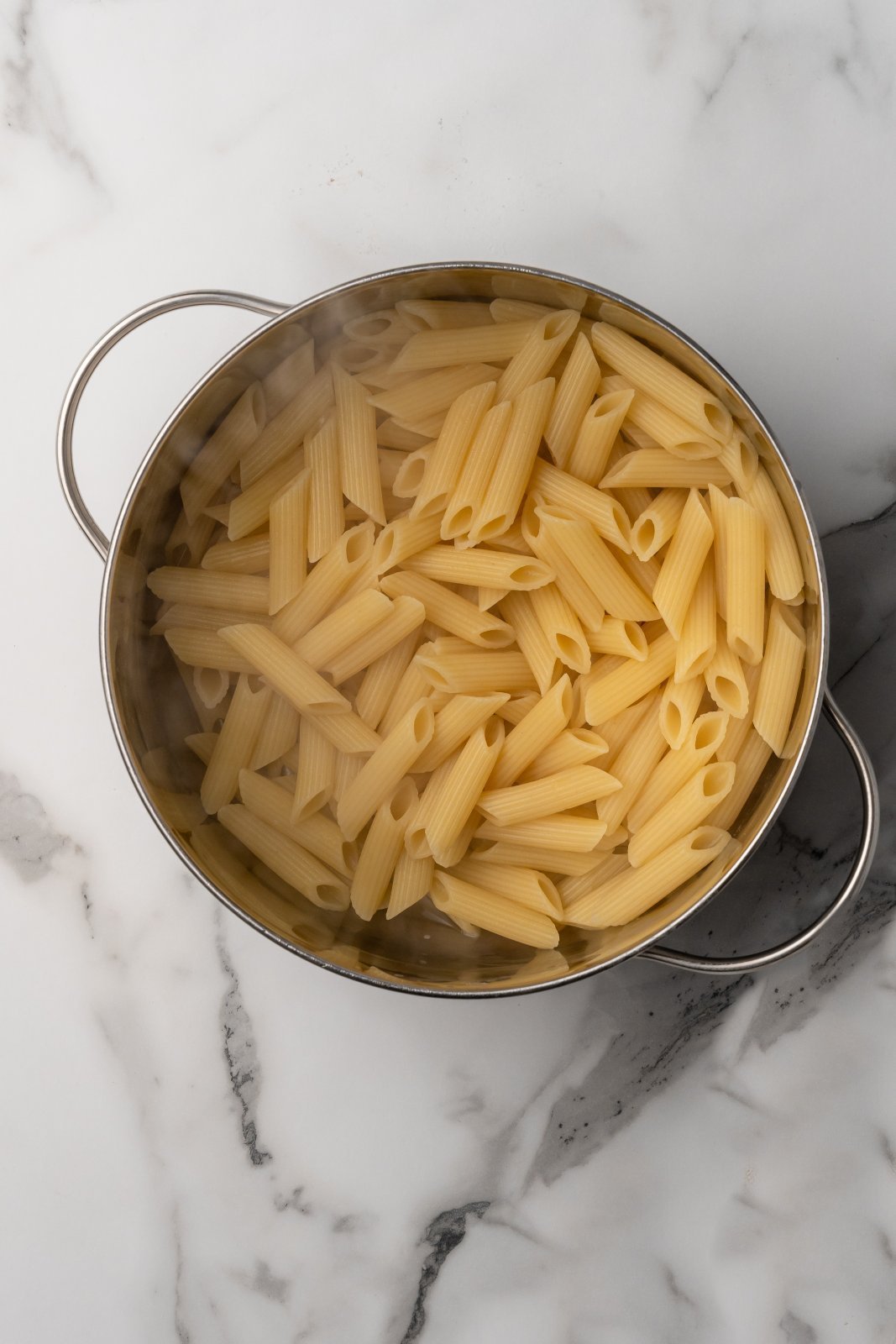 penne fully cooked in a soup pot