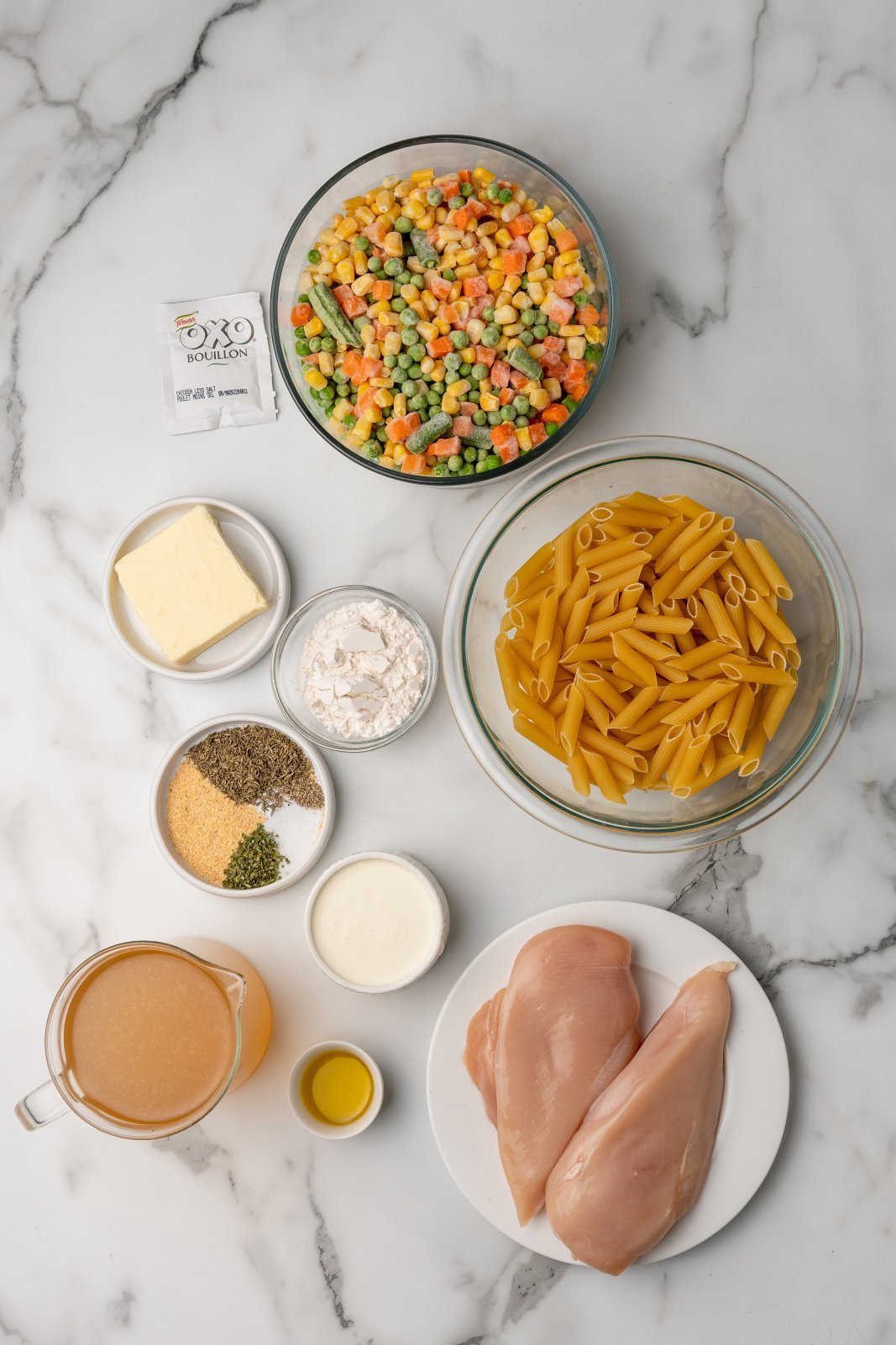 A top down view of the ingredients needed for chicken pot penne