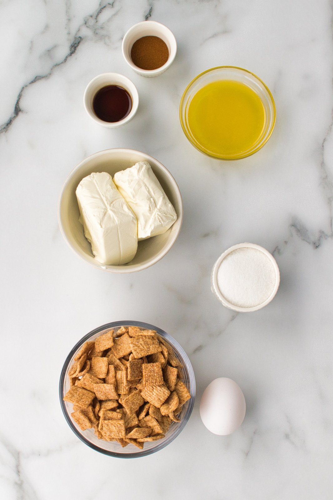 a top down view of the ingredients needed for cinnamon toast crunch cheesecake bites