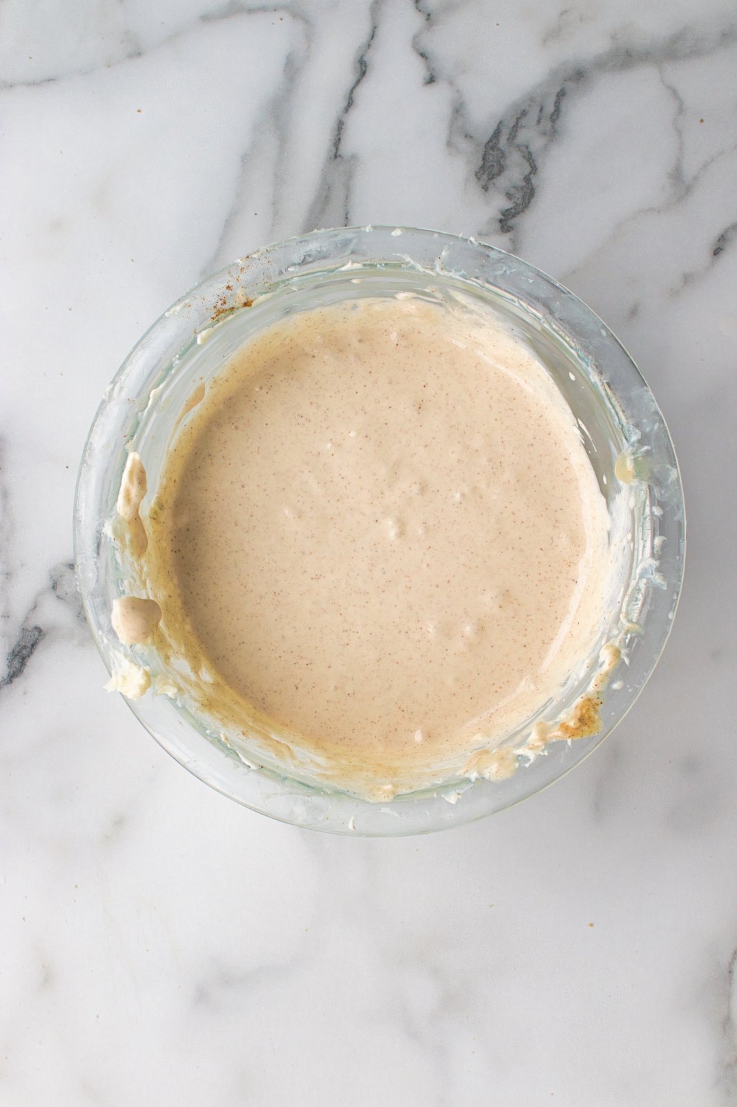 a bowl of cheesecake batter