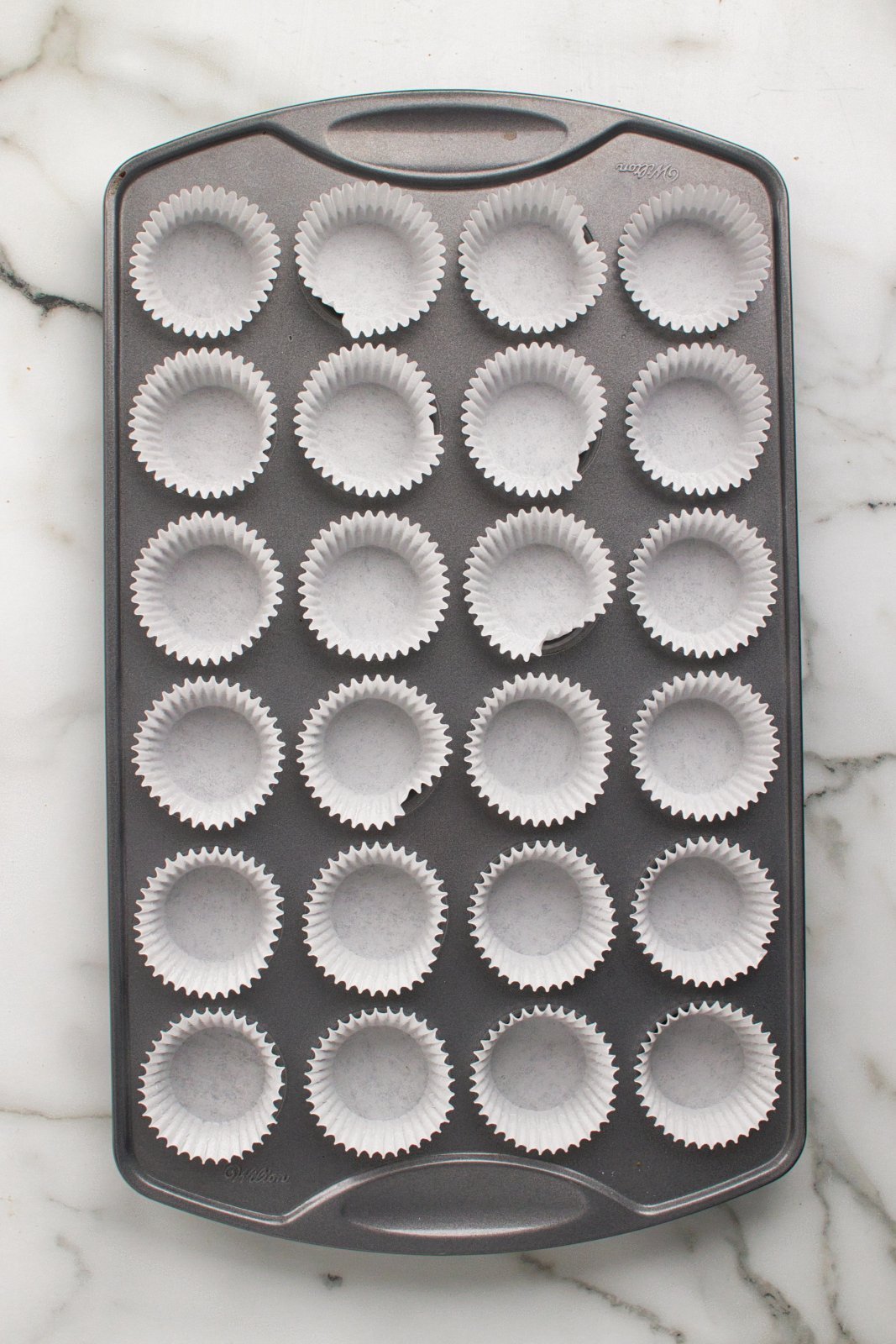 a mini muffin tin with liners