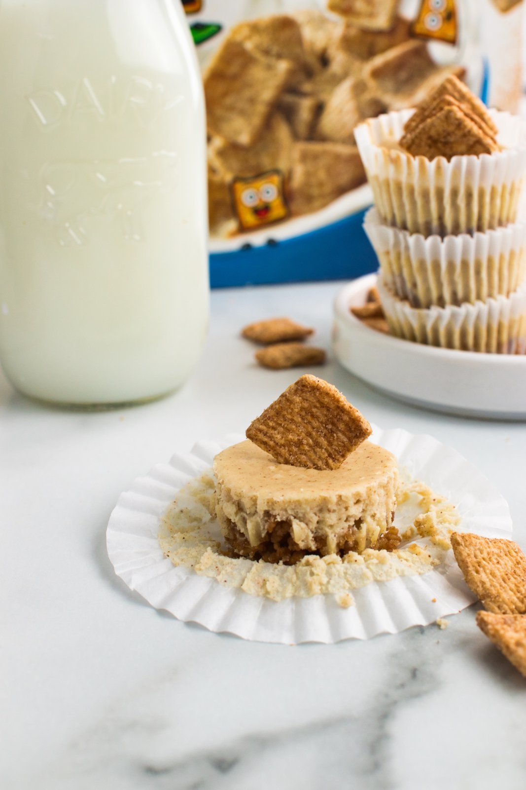 a cinnamon toast cheesecake bite with the wrapper pulled away