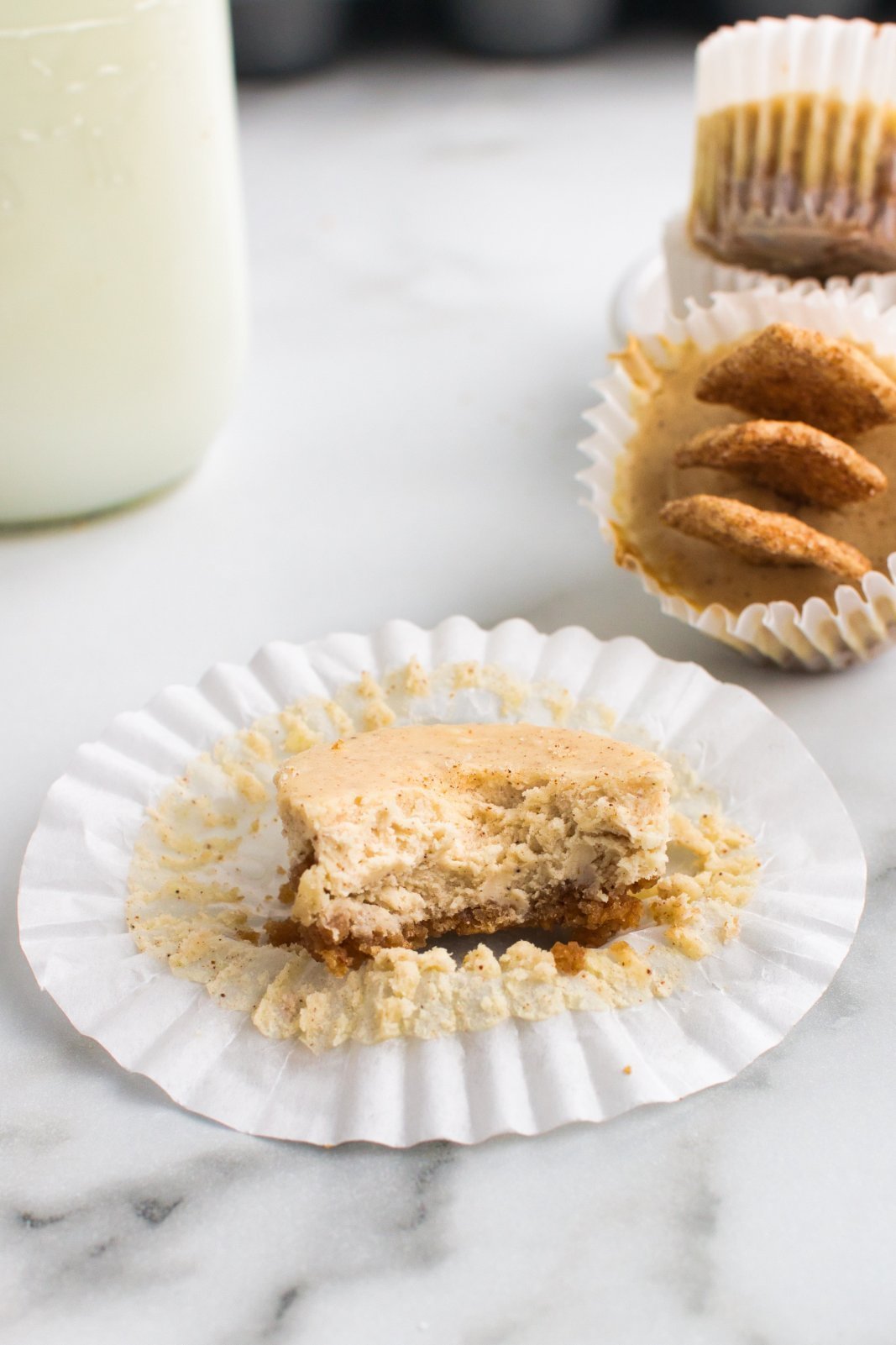 a close up of a cheesecake with a bite taken out