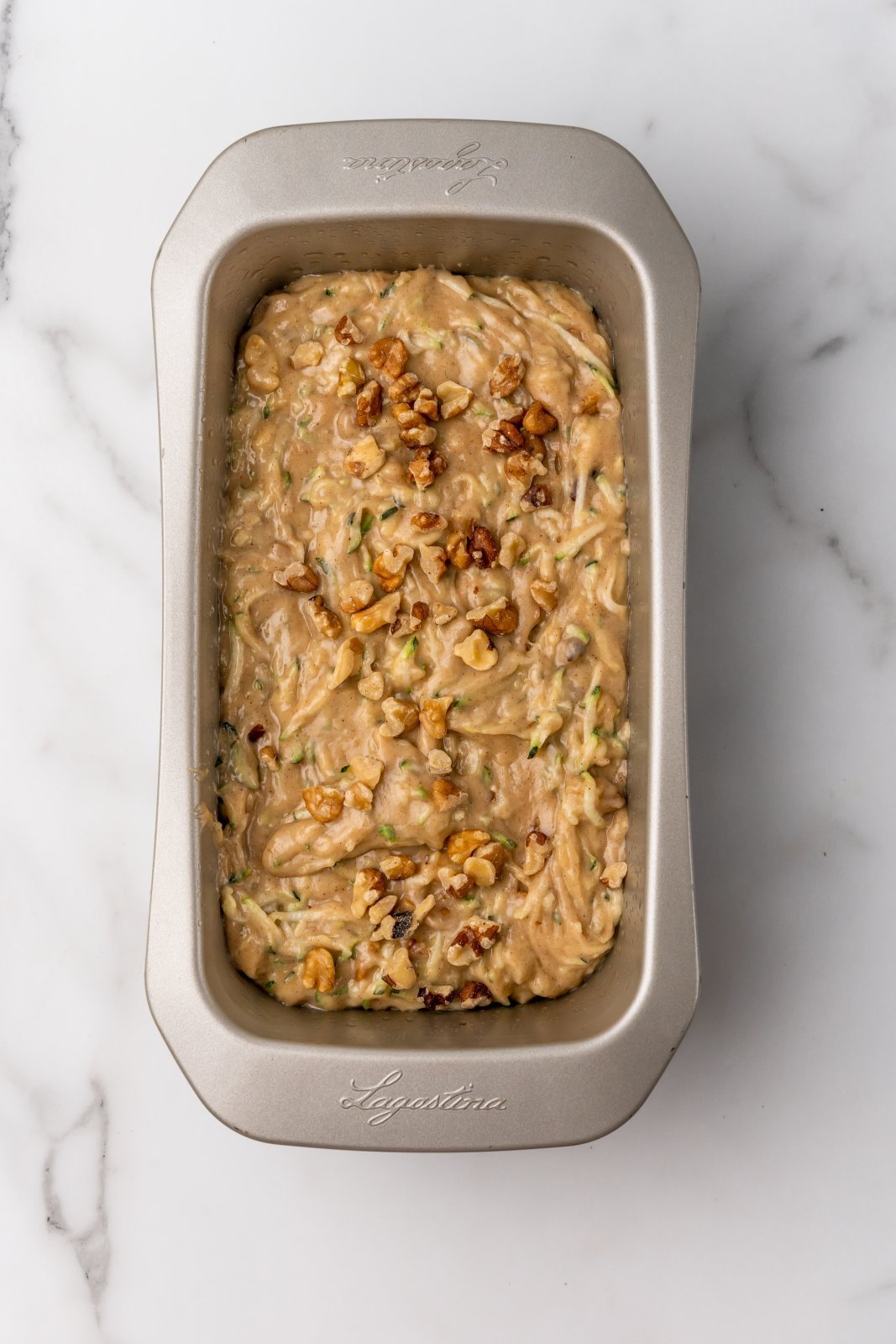 zucchini bread batter in loaf pan