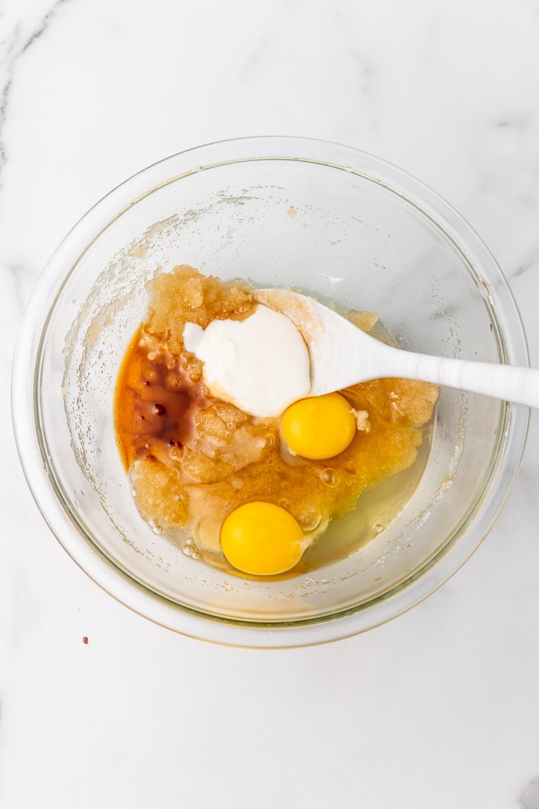 eggs, sour cream, and vanilla added to oil and sugar mixture