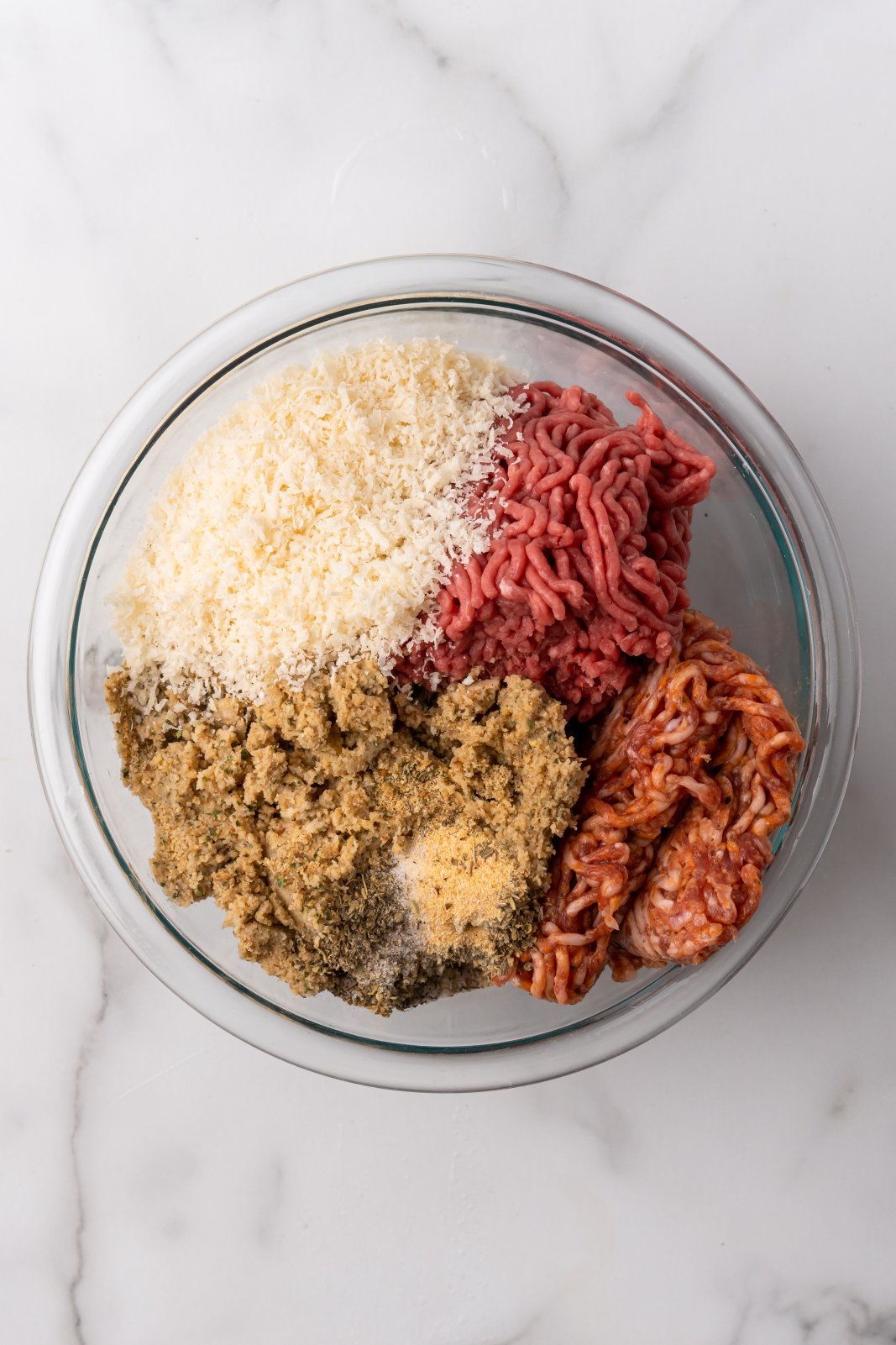 all ingredients for meatballs in a large bowl
