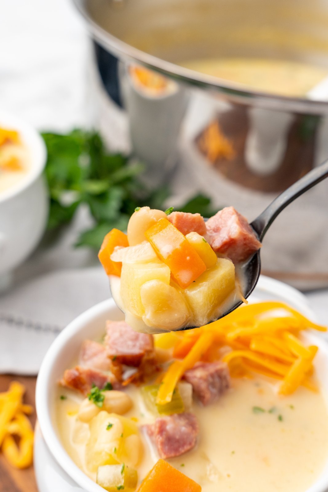 a spoonful of creamy ham soup