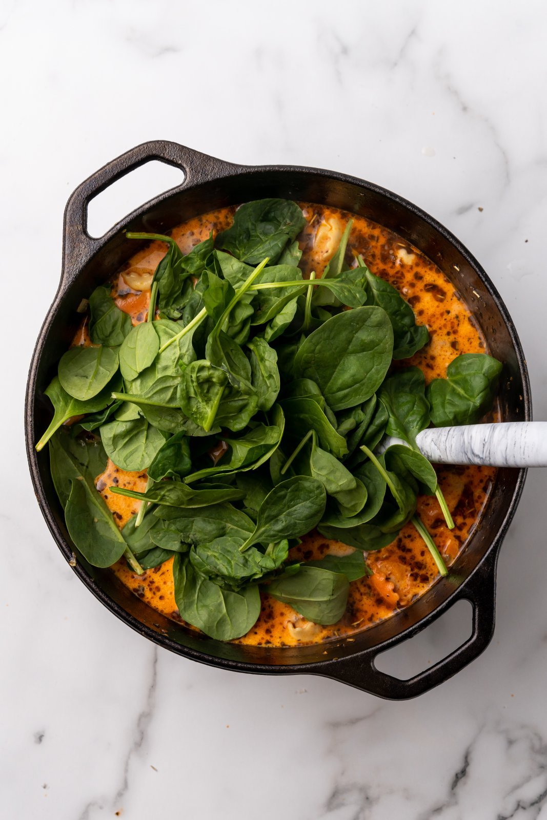 a view of the soup right after spinach is added