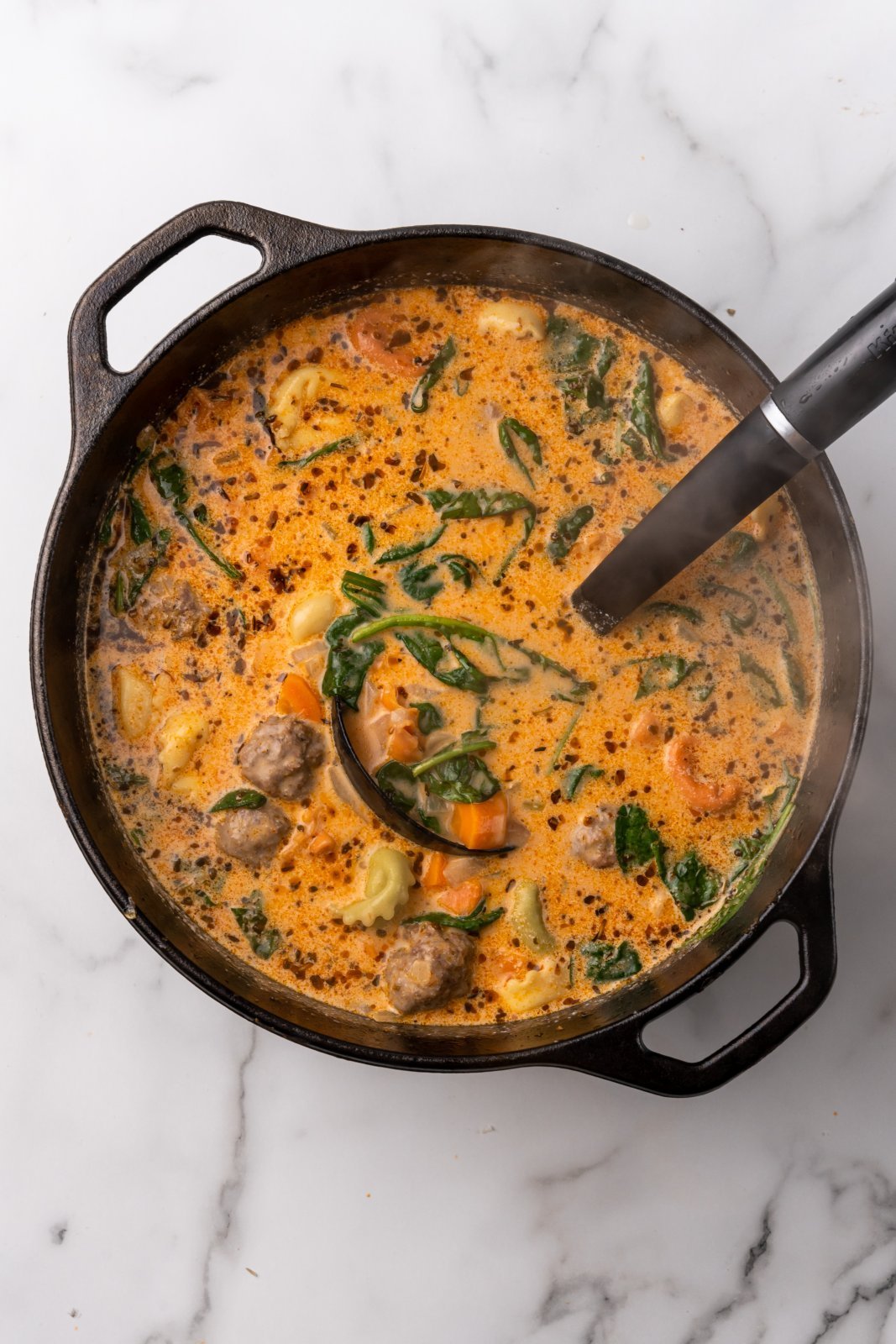 a view of the soup after spinach has wilted