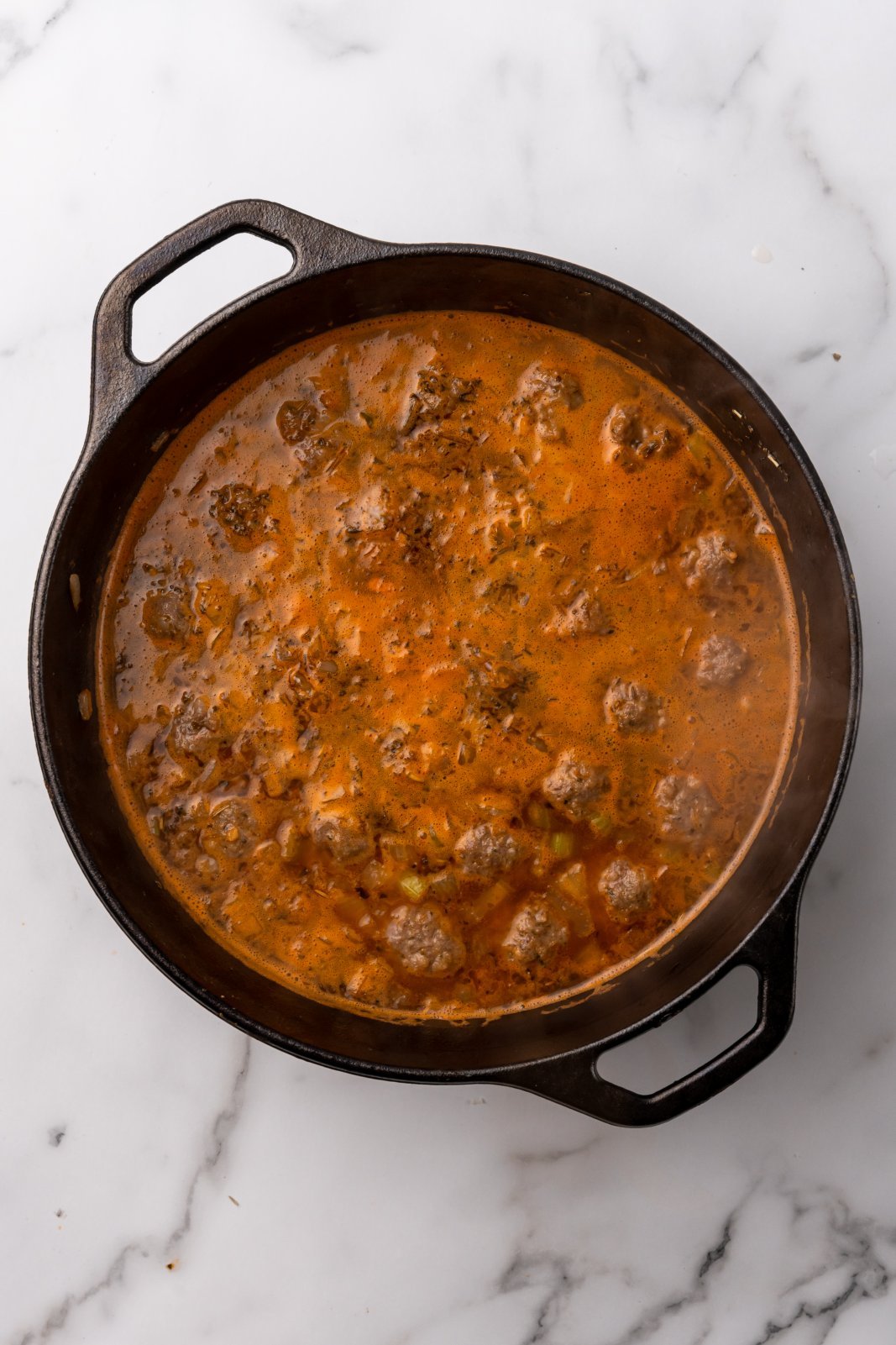 a view of the soup pot after meatballs and broth have been boiled together