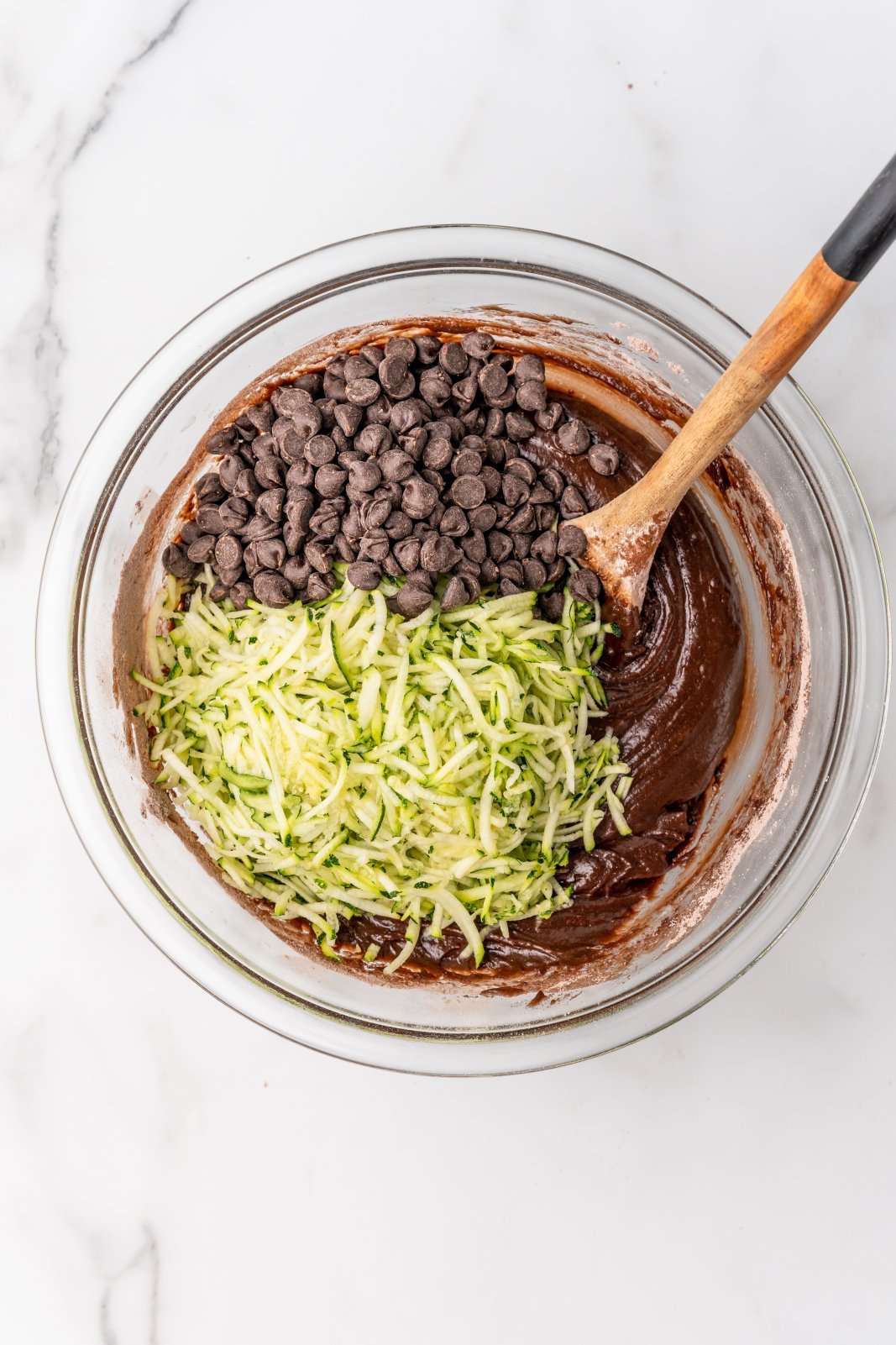 zucchini and chocolate chips on top of batter