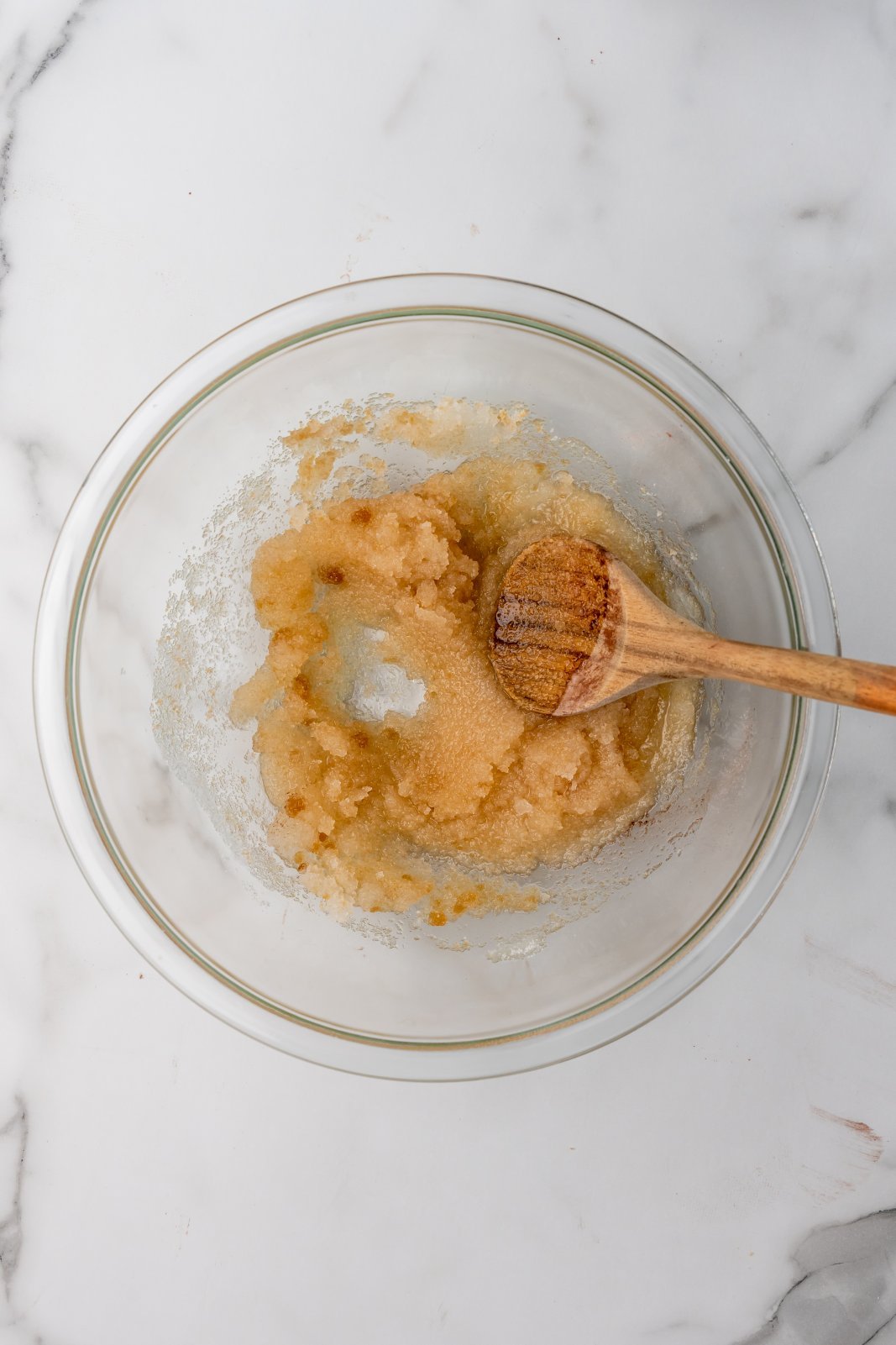oil and sugars mixed in a larger bowl