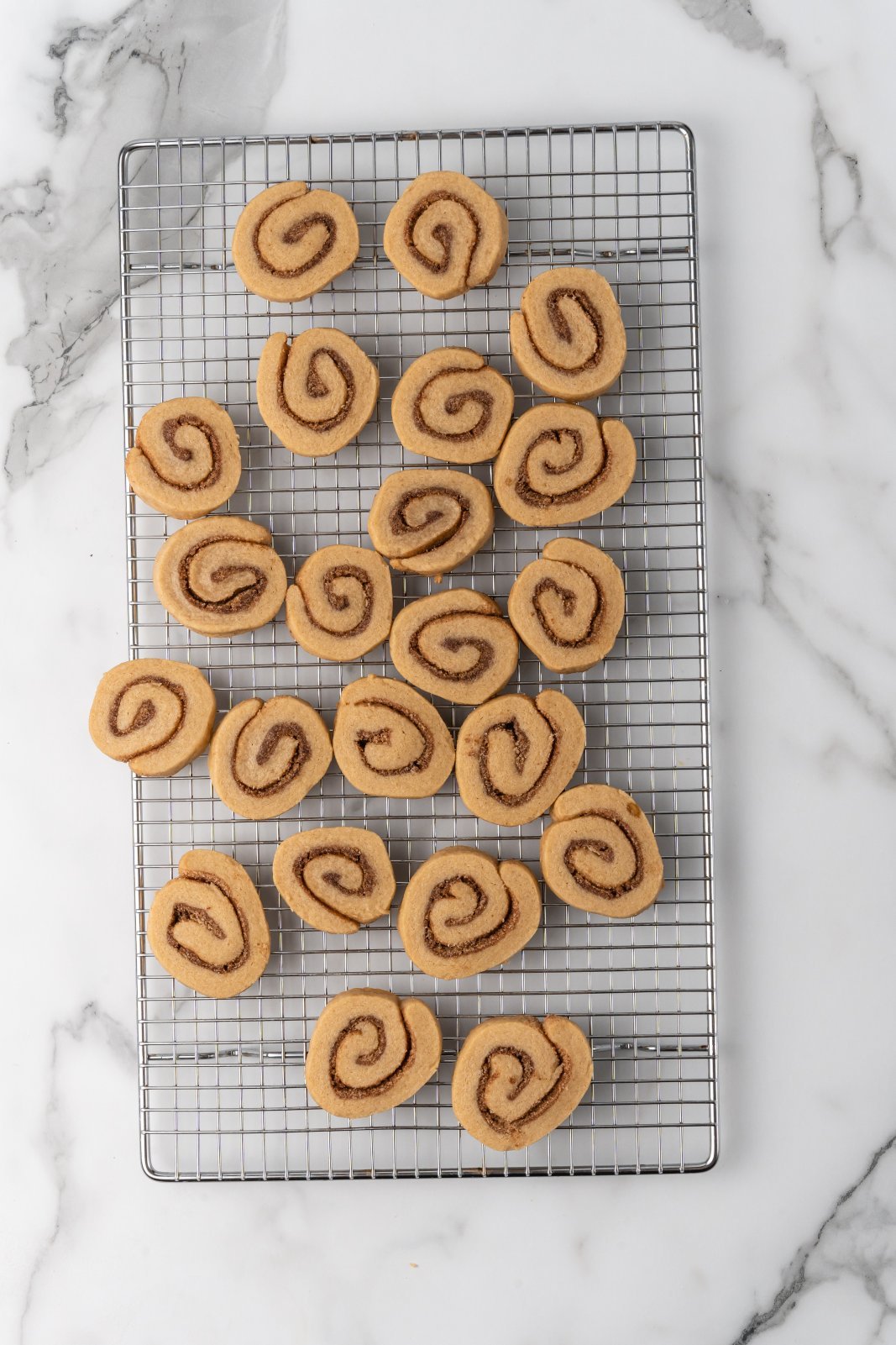 cinnamon roll cookies on a cooling rack