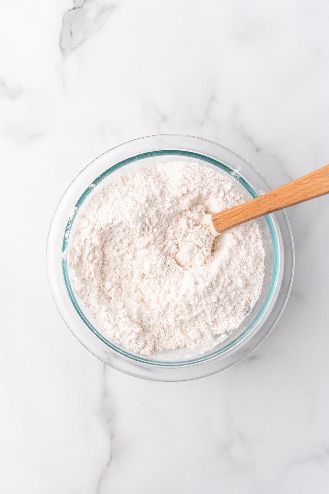 dry ingredients for cinnamon roll cookies mixed in a bowl