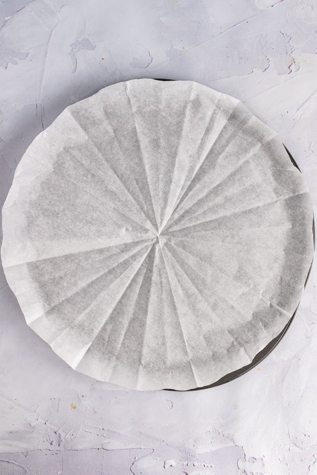 a pan with parchment paper lining is shown