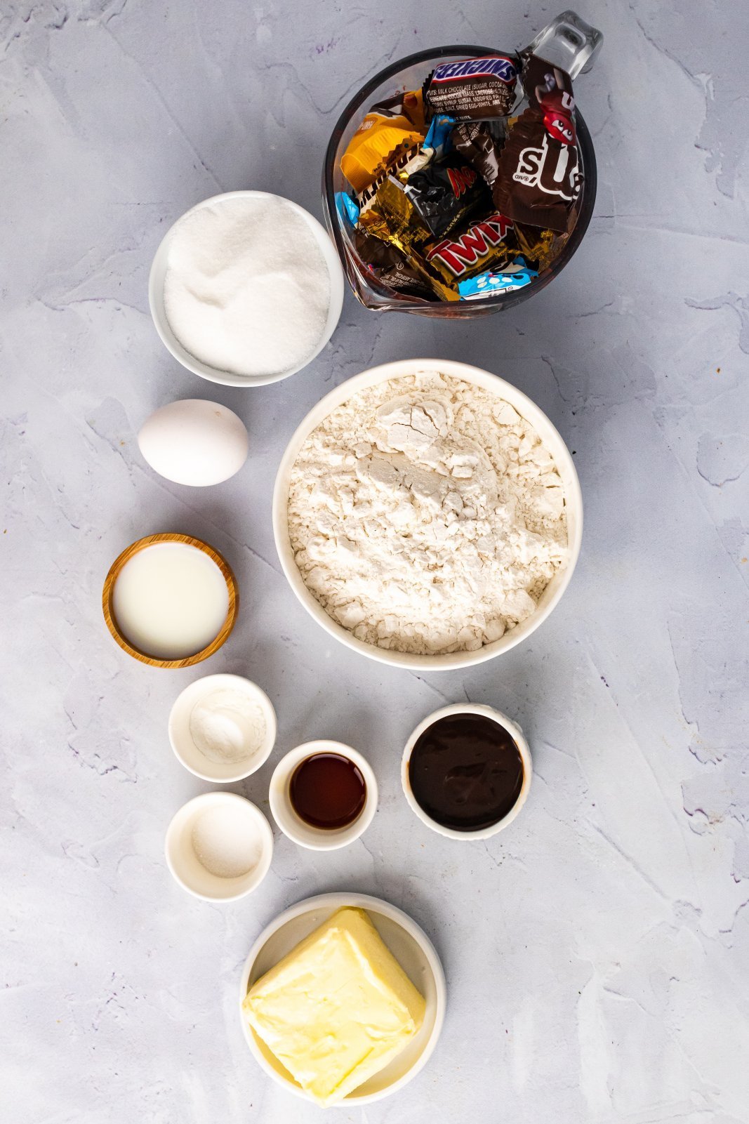 all the ingredients needed to make a Halloween Cookie Pizza
