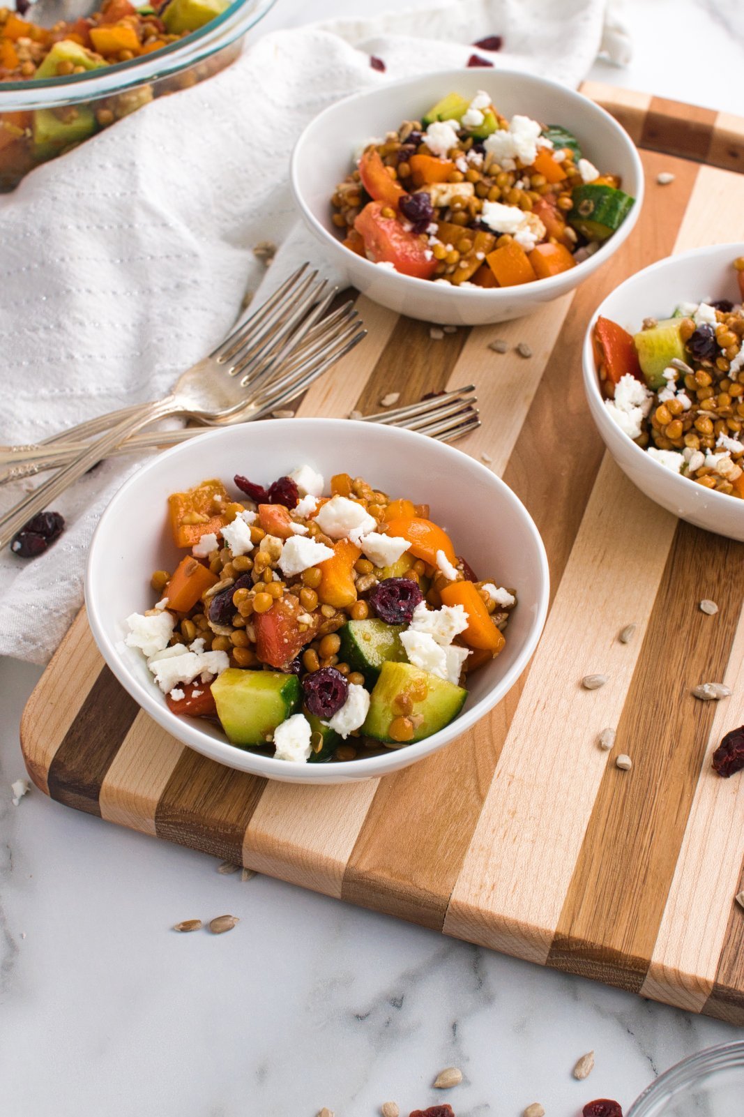 a close up of lentil feta salad in bowls
