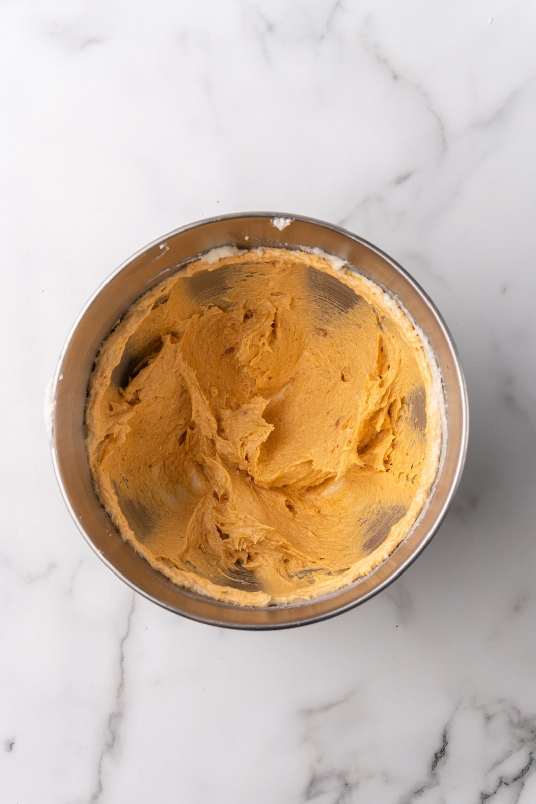 wet ingredients in the stand mixer bowl after being combined