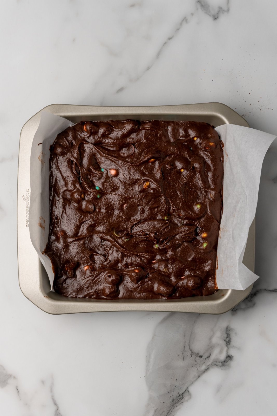 the pan with raw brownie batter
