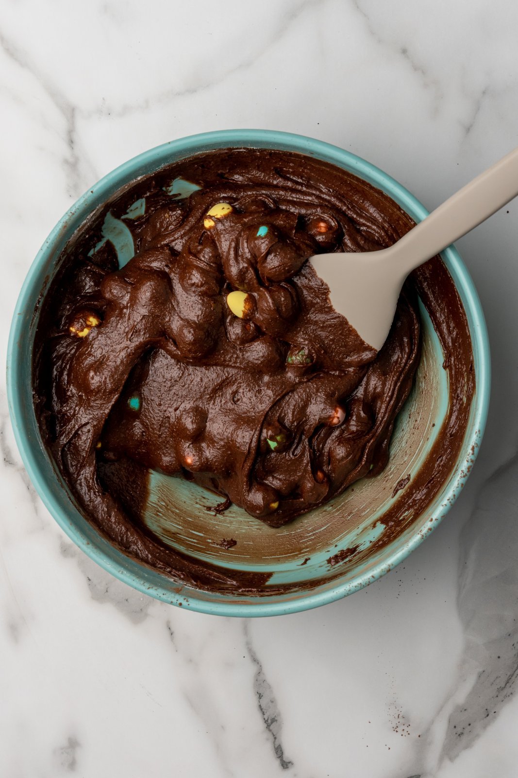 the brownie batter after mini eggs have been mixed in