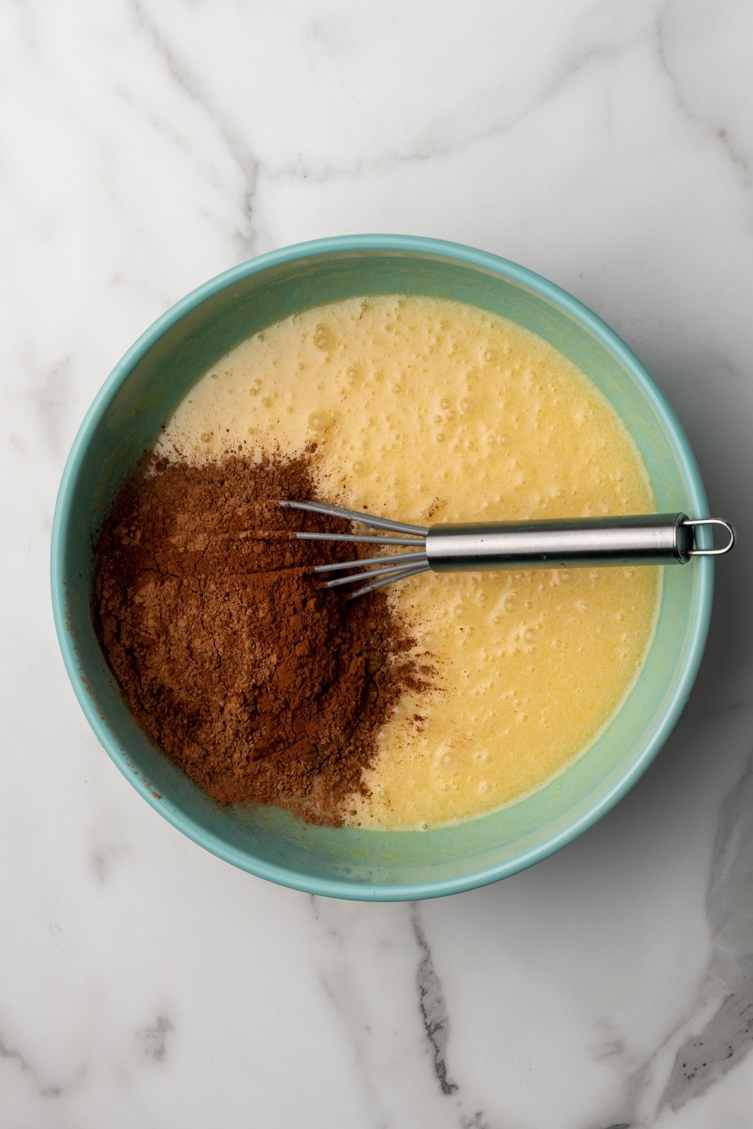 the butter mixture with cocoa powder on top