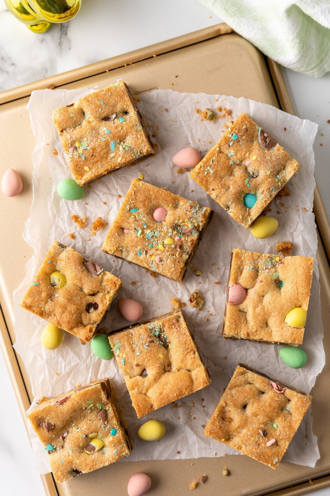 cookie bars scattered on a baking sheet