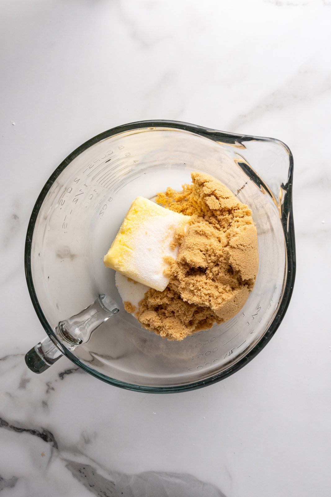 a bowl with butter and sugars