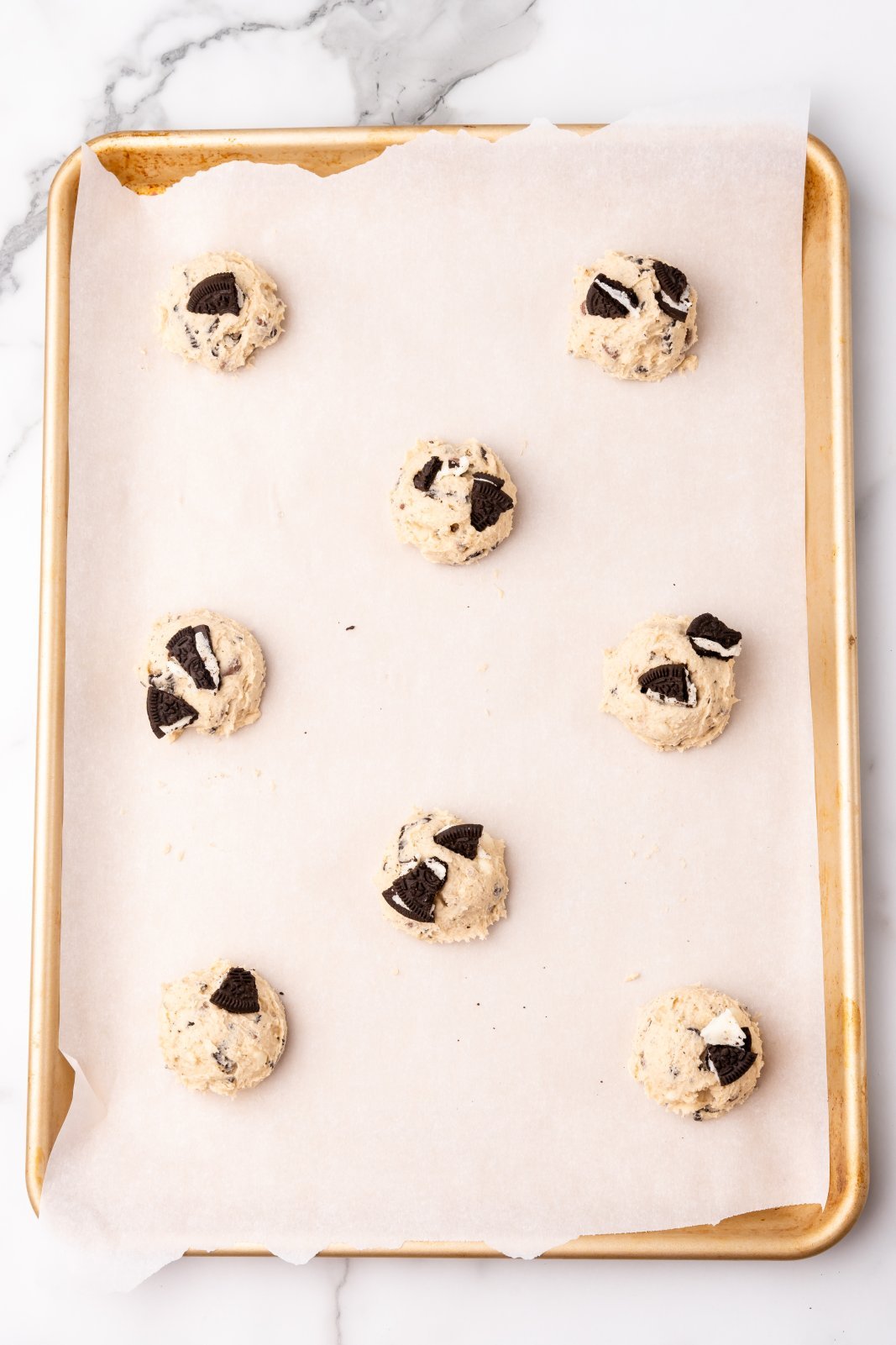 oreo cookies on a baking sheet before baking