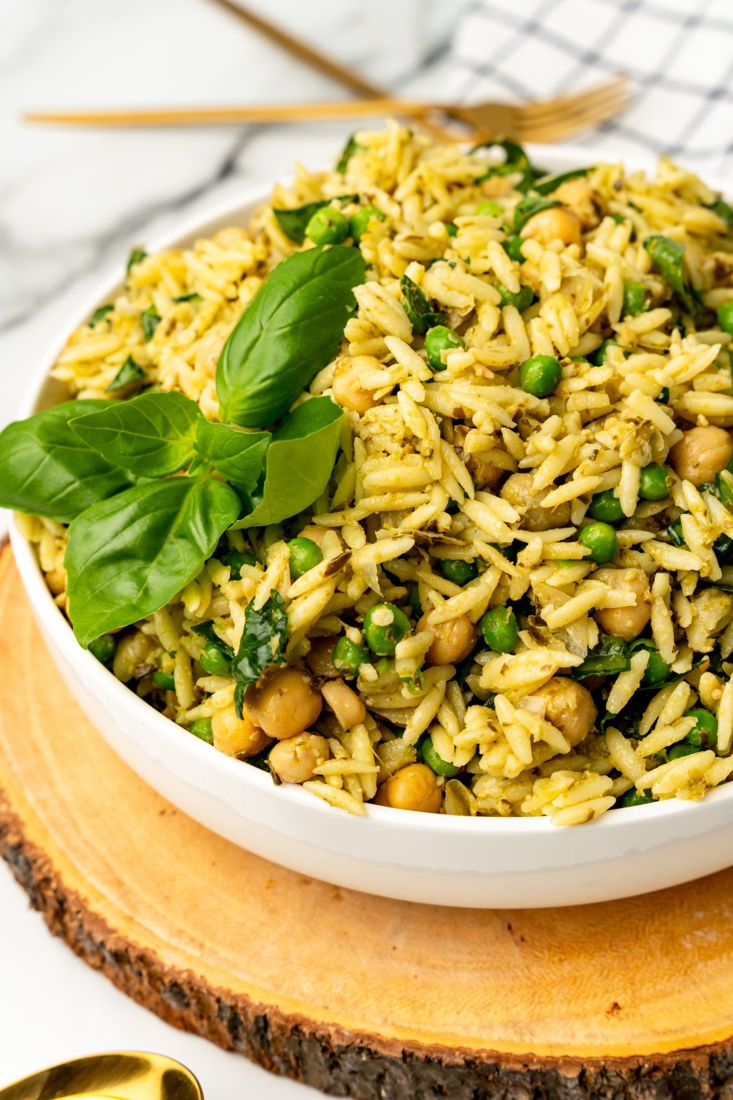 a close up of pesto orzo salad