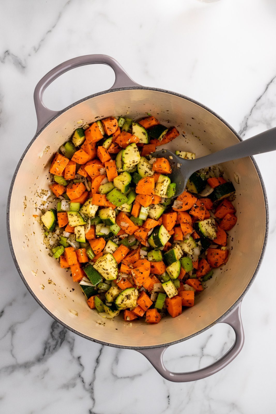 a pot with all the veggies and seasoning