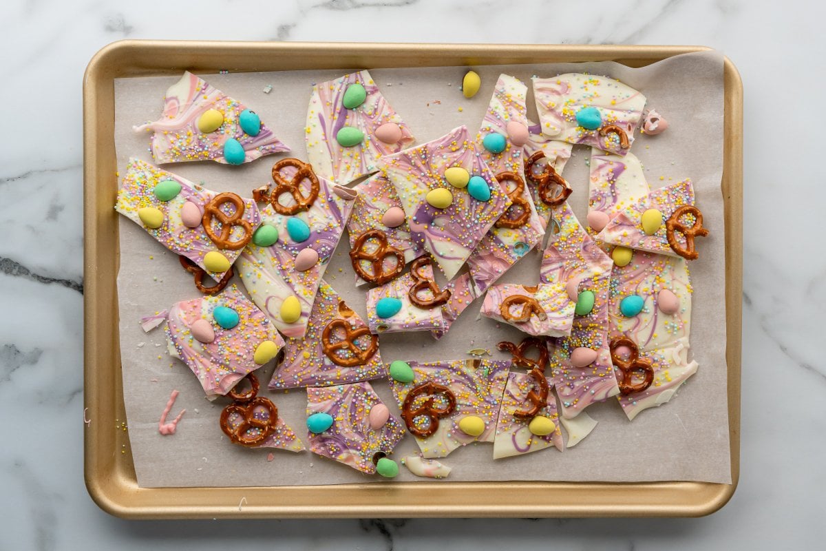 a tray with broken pieces of easter egg pretzel bark