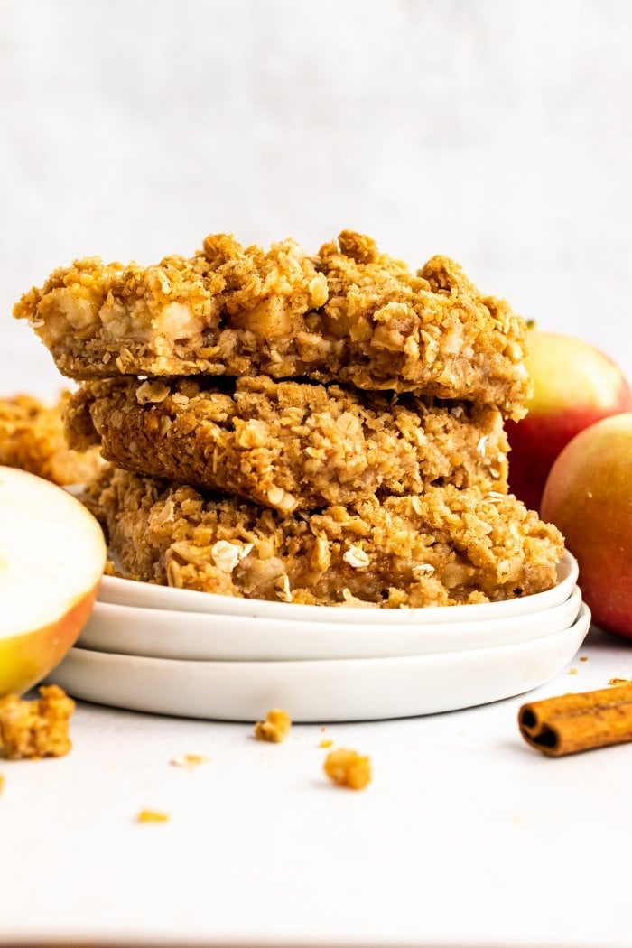 three apple crisp oat bars are shown stacked on top of each other