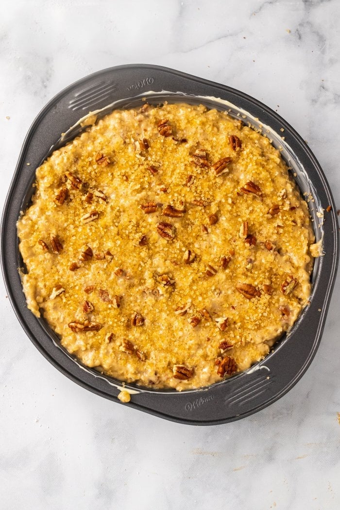The unbaked cake is shown in the baking pan