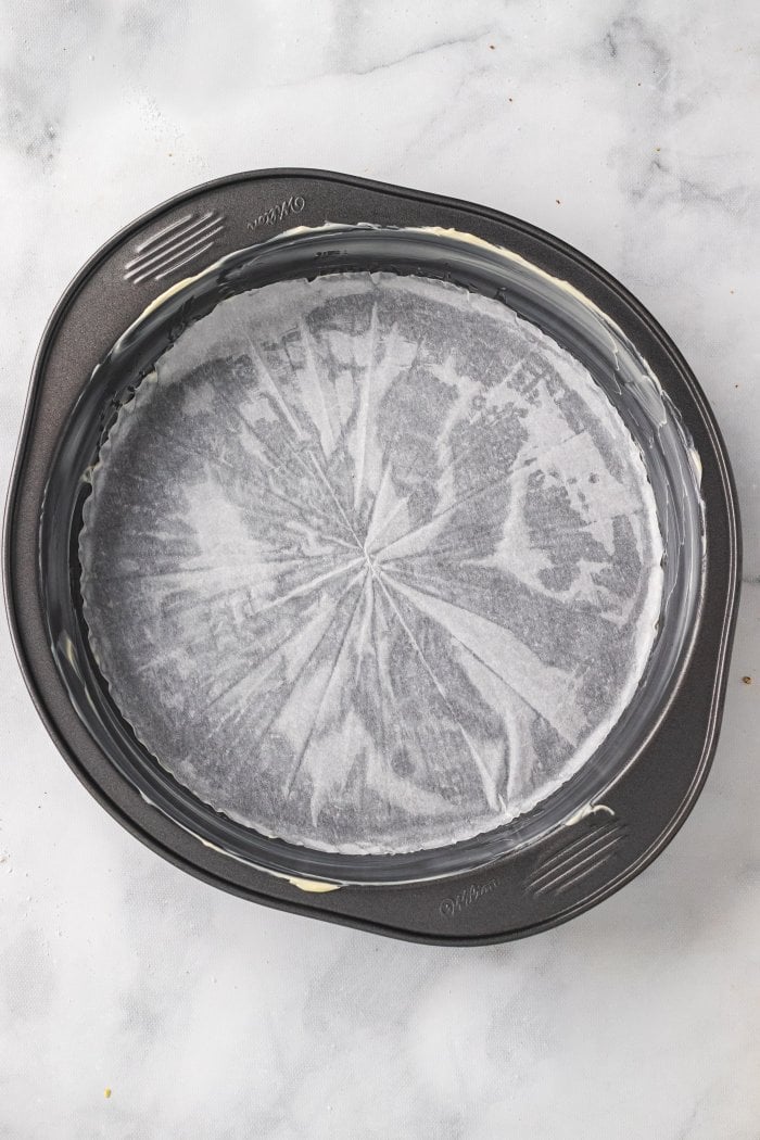 a baking pan lined with parchment and greased