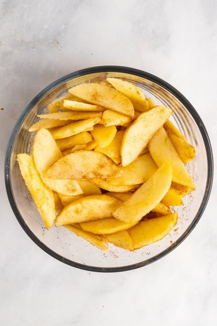 apple slices coated with cinnamon and sugar