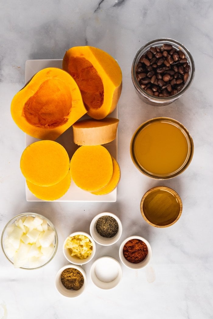 a top down view of the ingredients needed for black bean butternut squash soup