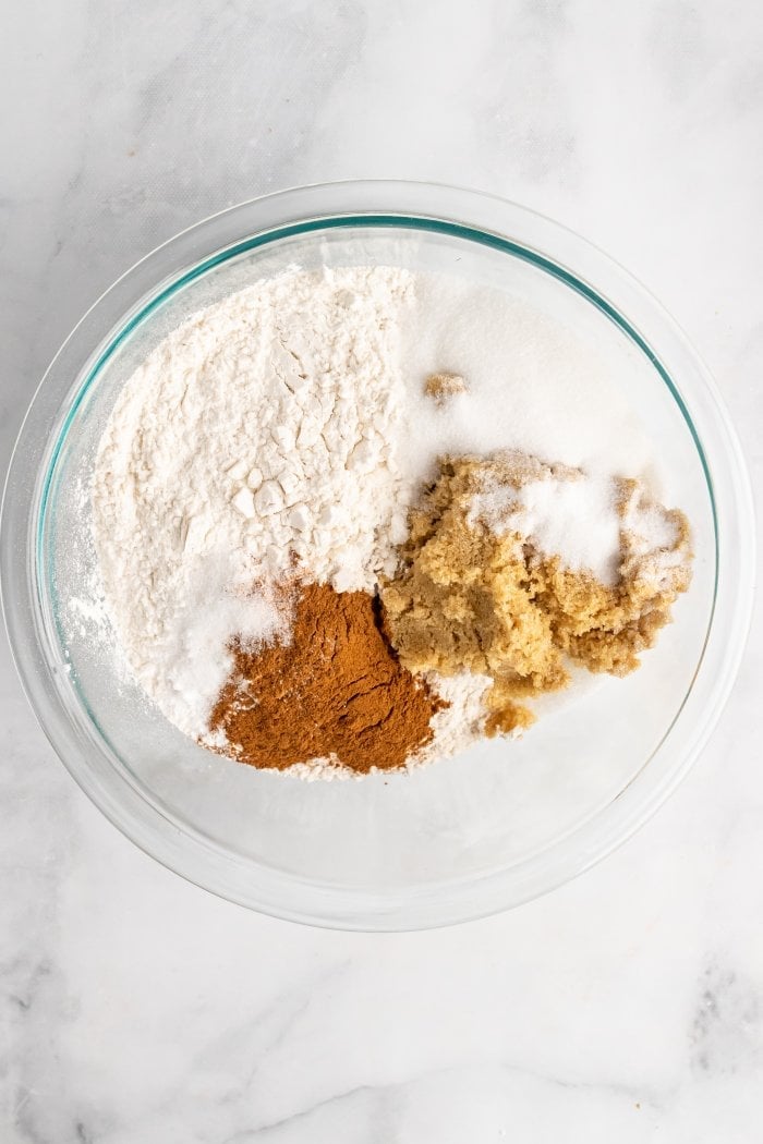 bowl showing all dry ingredients needed for peach cobbler muffins