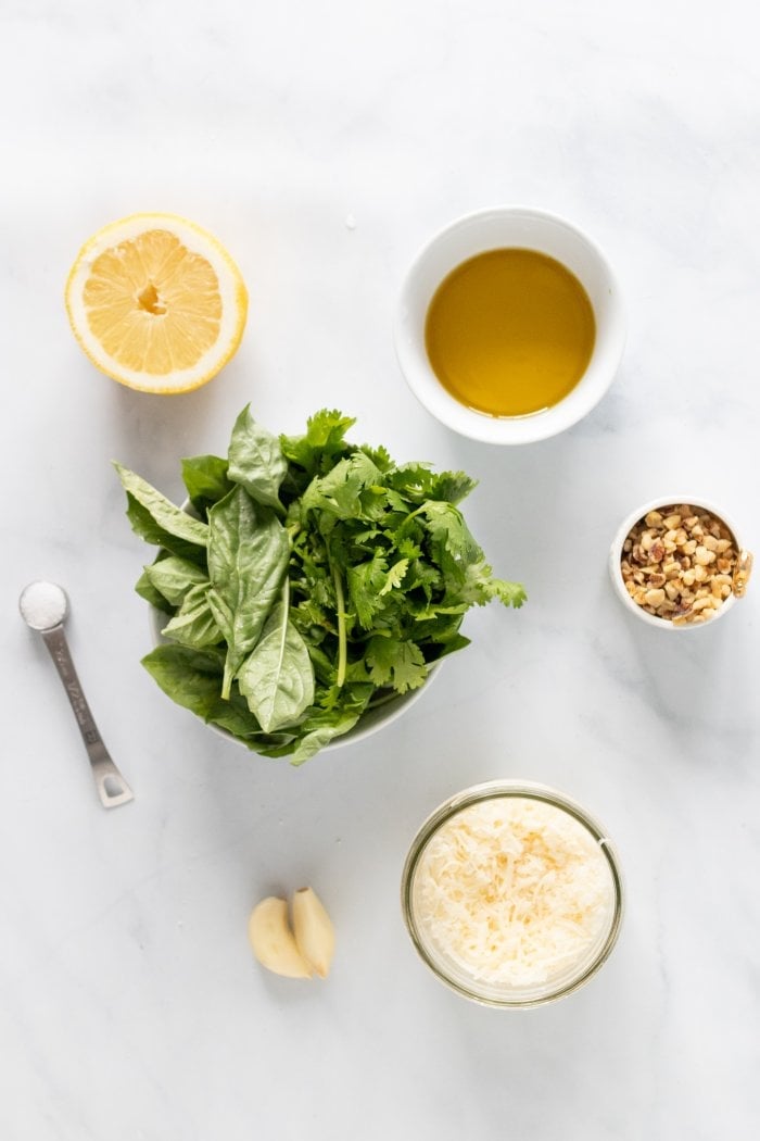 a top down view of the ingredients needed to make lemon basil pesto